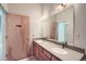 Modern bathroom with double sinks, spacious countertops, and plenty of natural light at 7700 E 29Th Ave # 404, Denver, CO 80238
