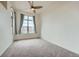 Bright bedroom with large windows providing natural light and a ceiling fan at 7700 E 29Th Ave # 404, Denver, CO 80238