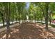 A serene tree-lined path offers a peaceful walking experience in a residential neighborhood at 7700 E 29Th Ave # 404, Denver, CO 80238
