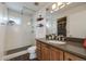 Modern bathroom featuring glass-enclosed shower, sleek vanity, and stylish fixtures, offering a spa-like experience at 2607 W 24Th Ave, Denver, CO 80211