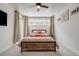 Serene bedroom featuring a bed with rustic wood accents, natural light, and warm decor, creating a peaceful ambiance at 2607 W 24Th Ave, Denver, CO 80211
