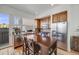 Well-lit kitchen with stainless steel appliances, wood cabinets, and a stylish central island dining space at 2607 W 24Th Ave, Denver, CO 80211