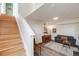 Spacious living room with hardwood floors, stairs to upper levels and tasteful furnishings at 2607 W 24Th Ave, Denver, CO 80211