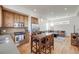 Open-concept living area featuring hardwood floors, modern track lighting, and a comfortable sectional sofa at 2607 W 24Th Ave, Denver, CO 80211