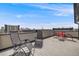 Spacious rooftop deck offering city views, lounge chairs, and outdoor seating, perfect for relaxation and entertaining at 2607 W 24Th Ave, Denver, CO 80211