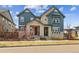 Charming two-story home with a landscaped front yard and inviting entryways at 5687 Dayton St, Denver, CO 80238