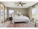 Bright bedroom with a ceiling fan, neutral walls, and modern furnishings at 5687 Dayton St, Denver, CO 80238