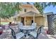 Private backyard with covered patio and outdoor seating, perfect for entertaining at 7504 E Jefferson Dr, Denver, CO 80237