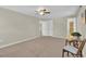 Spacious bedroom has neutral paint and carpet, ceiling fan, and double door closet at 7504 E Jefferson Dr, Denver, CO 80237