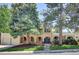 Charming two-story home with well-maintained lawn and mature trees enhancing curb appeal at 7504 E Jefferson Dr, Denver, CO 80237