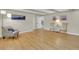Spacious living room featuring hardwood floors, neutral paint, and modern lighting at 7504 E Jefferson Dr, Denver, CO 80237