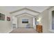 Bright living room featuring vaulted ceilings with exposed beams and natural light at 7504 E Jefferson Dr, Denver, CO 80237
