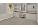 Cozy office features custom built-ins, neutral paint, and abundant natural light at 7504 E Jefferson Dr, Denver, CO 80237