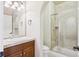 A bathroom featuring vanity sink, tile shower, and modern fixtures at 4775 S Anaheim Ct, Aurora, CO 80015