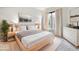 Relaxing bedroom with a comfortable bed, soft lighting, and minimalist decor, creating a serene retreat at 4775 S Anaheim Ct, Aurora, CO 80015