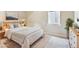 Cozy bedroom features a neatly made bed, decorative pillows, and ambient lighting for a warm atmosphere at 4775 S Anaheim Ct, Aurora, CO 80015