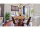 Breakfast nook features a modern round table and chairs, and access to a patio at 4775 S Anaheim Ct, Aurora, CO 80015
