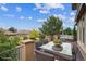 Outdoor deck with seating and views, perfect for entertaining or relaxing outdoors at 4775 S Anaheim Ct, Aurora, CO 80015
