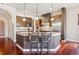 Spacious kitchen with stainless steel appliances, wood cabinets and granite countertops on the island at 4775 S Anaheim Ct, Aurora, CO 80015