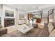 Basement living room featuring a fireplace, bar and staircase to the upper level at 4775 S Anaheim Ct, Aurora, CO 80015