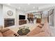 Living room with fireplace, home bar, and plenty of seating at 4775 S Anaheim Ct, Aurora, CO 80015