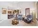 Open concept living space with a kitchen view and comfortable seating arrangements at 4775 S Anaheim Ct, Aurora, CO 80015