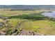 Scenic aerial view showcasing the community's proximity to green space, lakes, and city at 4603 S Abilene Cir, Aurora, CO 80015