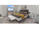 Comfortable bedroom with a sliding glass door access to the deck and outdoor views at 4603 S Abilene Cir, Aurora, CO 80015
