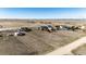 Wide aerial shot captures the home's location within a sprawling landscape, bordered by fencing at 7440 S Shenandoah Dr, Elizabeth, CO 80107