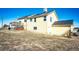 A clear view of the home's back exterior, showcasing the siding and the neat landscaping at 7440 S Shenandoah Dr, Elizabeth, CO 80107