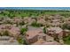 An expansive aerial view of the neighborhood with mountain views in the distance at 9228 Sori Ln, Highlands Ranch, CO 80126