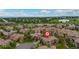 Stunning aerial view of the community with mature trees, meticulously maintained lawns and beautiful residences at 9228 Sori Ln, Highlands Ranch, CO 80126