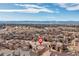 Expansive aerial view of a residential neighborhood with mountain views in the distance at 9228 Sori Ln, Highlands Ranch, CO 80126