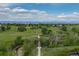 Picturesque aerial image showcasing walking paths, lush greenery and mountain views in the distance at 9228 Sori Ln, Highlands Ranch, CO 80126