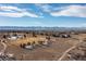 Aerial view of open space in luxury community showing walking paths and the mountain views in the distance at 9228 Sori Ln, Highlands Ranch, CO 80126