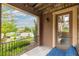 Balcony view with wicker furniture, overlooking the street, and lined with green landscaping at 9228 Sori Ln, Highlands Ranch, CO 80126