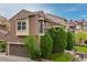 Beautiful two-story home with a private balcony, lush landscaping, and attached two-car garage at 9228 Sori Ln, Highlands Ranch, CO 80126