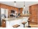 Spacious kitchen featuring granite countertops, stainless steel appliances, and breakfast bar at 9228 Sori Ln, Highlands Ranch, CO 80126