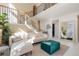 Living room with open staircase, and view to other rooms of the house at 9228 Sori Ln, Highlands Ranch, CO 80126
