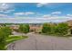Neighborhood street view of upscale homes with well-maintained landscaping and blue skies at 9228 Sori Ln, Highlands Ranch, CO 80126