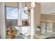 Exterior dining with glass top table, seating for six and large windows with mountain views at 9228 Sori Ln, Highlands Ranch, CO 80126