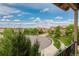 Neighborhood street view of upscale homes with well-maintained landscaping and blue skies at 9228 Sori Ln, Highlands Ranch, CO 80126