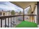 Balcony showcasing a view of the neighborhood and surrounding trees at 7790 W 87Th Dr # H, Arvada, CO 80005