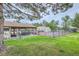 Outdoor pool, picnic tables, tennis courts surrounded by greenery at 7790 W 87Th Dr # H, Arvada, CO 80005