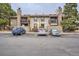 Charming condo building featuring stone accents, balconies and three convenient parking spaces at 7790 W 87Th Dr # H, Arvada, CO 80005