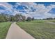 Expansive community green space featuring walking paths and picnic area for residents to enjoy at 7790 W 87Th Dr # H, Arvada, CO 80005