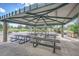 Covered picnic area featuring rows of tables, perfect for outdoor dining and gatherings at 7790 W 87Th Dr # H, Arvada, CO 80005