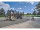 Inviting community playground featuring climbing structures, swings, and slides with well-maintained surrounding landscape and seating at 7790 W 87Th Dr # H, Arvada, CO 80005