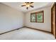 Bedroom featuring carpet flooring, neutral walls, and a window with blinds, providing ample natural light at 16247 E Belleview Pl, Centennial, CO 80015