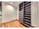 Walk-in closet with built-in shelving units and ample storage space at 16247 E Belleview Pl, Centennial, CO 80015